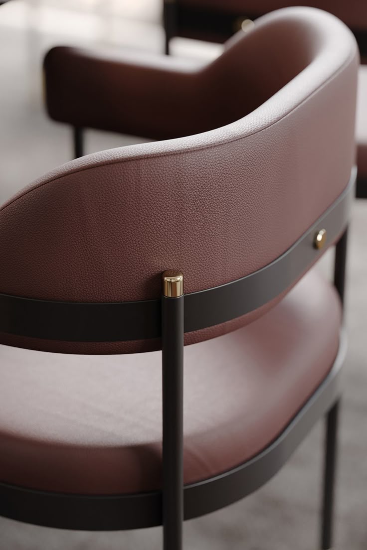 Close-up of genuine leather upholstery on a curved armchair