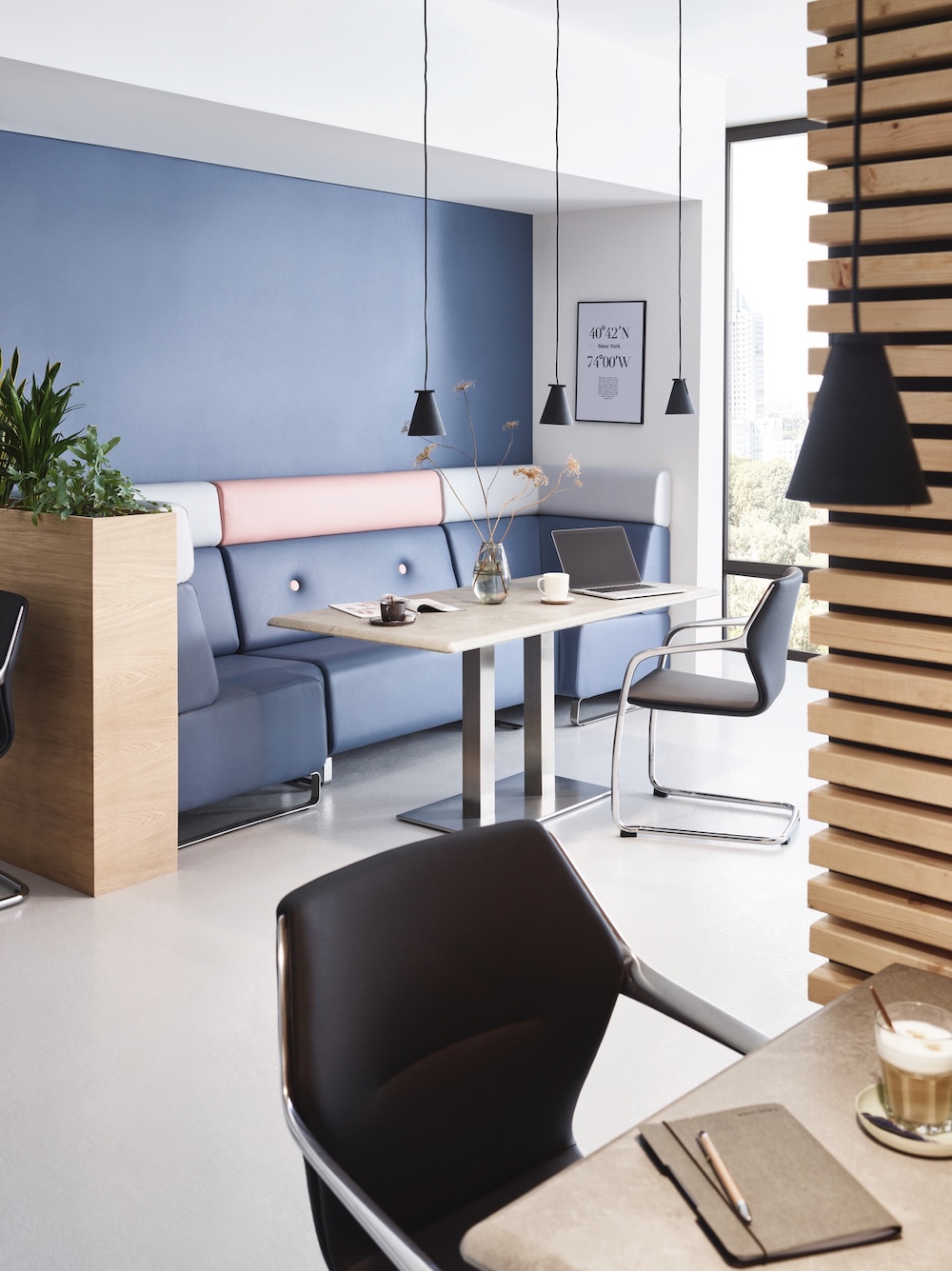 Contemporary breakout area with custom banquette seating in colour-blocked vinyl